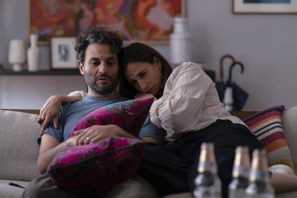 This image released by A24 shows Arian Moayed, left, and Michaela Watkins in a scene from "You Hurt My Feelings." (Jeong Park/A24 via AP)