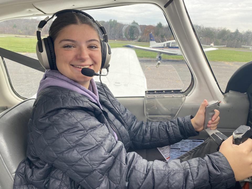 Sophie Fontano, a student in the Wallenpaupack Aeronautical Science & Aviation (WASA), has been taking private pilot lessons as well. Sophie is seen in the cockpit at Cherry Ridge Airport on the day of her first flight. She is among 20 pictured on the wall in her high school classroom who have taken their first flight as a pilot in training.