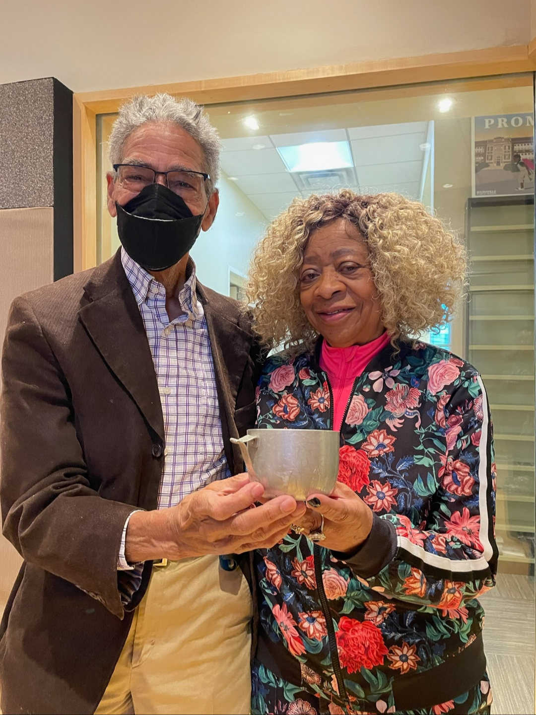 King Madison Hollands and fellow civil rights activist Frankie Henry hold the tin cup he was given while jailed in February 1960 for eating at the Woolworths lunch counter in downtown Nashville.