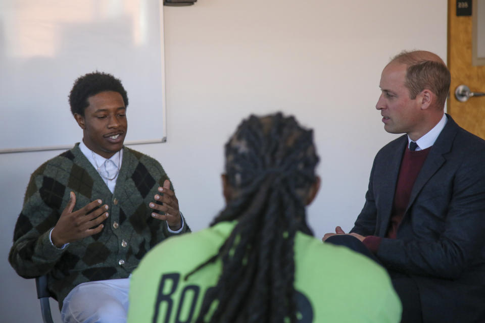 Britain's Prince William listens to Jonathan Williams, a participant of Roca's Young Men's Program, Thursday Dec. 1, 2022, in Chelsea, Mass. (AP Photo/Reba Saldanha, Pool)