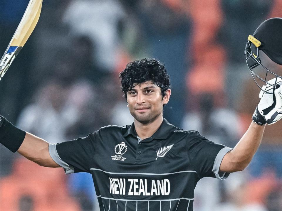 New Zealand’s Rachin Ravindra celebrates after scoring a century (100 runs) during the 2023 ICC men’s cricket World Cup one-day international (ODI) match between England and New Zealand at the Narendra Modi Stadium in Ahmedabad on 5 October (AFP via Getty Images)