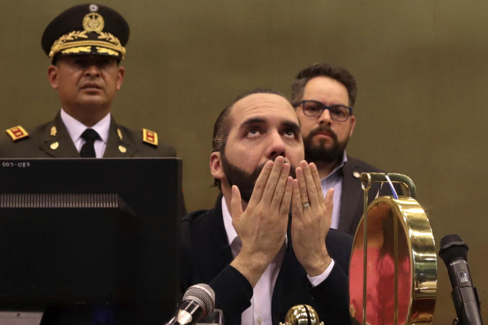 FILE - El Salvador's President Nayib Bukele offers a prayer in Congress, in San Salvador, El Salvador, Feb. 9, 2020. Since Bukele came into power in 2019, there have been setbacks for the LGBT community. Among other actions, the government dissolved the Ministry for Social Inclusion, which conducted training on gender identity and investigated LGBT issues nationwide. (AP Photo/Salvador Melendez, File)
