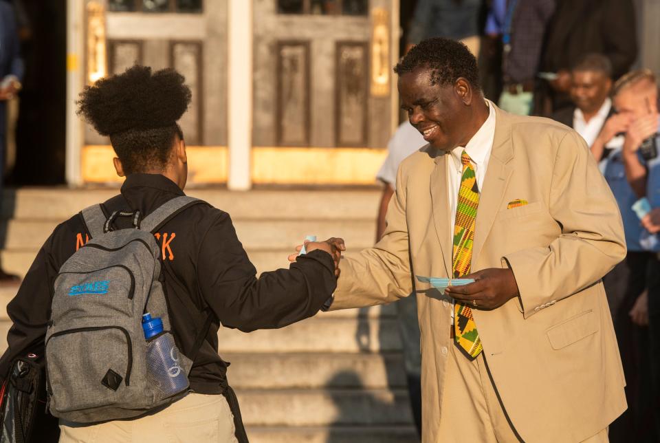 Pastor Ken Austin welcomes students at Lanier High School in Montgomery, Ala., on Wednesday, Sept. 14, 2022.