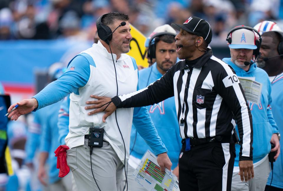 Tennessee Titans Head Coach Mike Vrabel argues his case for an intentional grounding penalty against the Houston Texans with line judge Julian Mapp (10) during their game at Nissan Stadium in Nashville, Tenn., Sunday, Dec. 17, 2023.