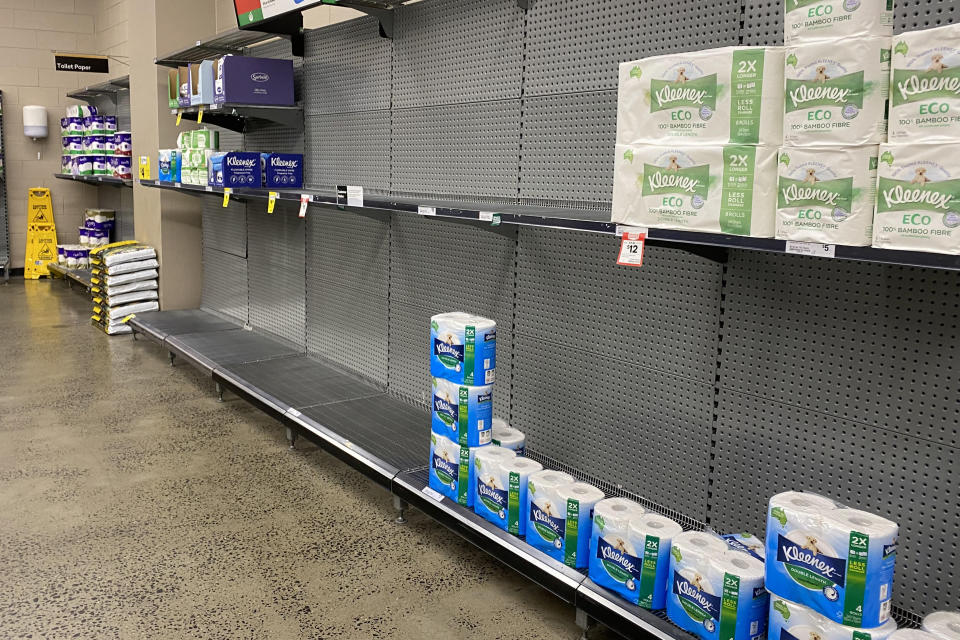 Empty shelves of toilet paper products are seen at a supermarket in Sydney on Friday. Source: AAP