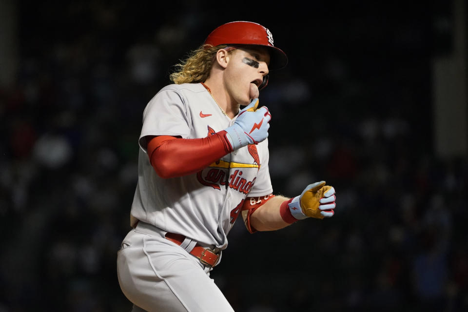 St. Louis Cardinals' Harrison Bader celebrates his home run off Chicago Cubs relief pitcher Adam Morgan in front of the Chicago Cubs bench during the seventh inning of a baseball game Friday, Sept. 24, 2021, in Chicago. (AP Photo/Charles Rex Arbogast)