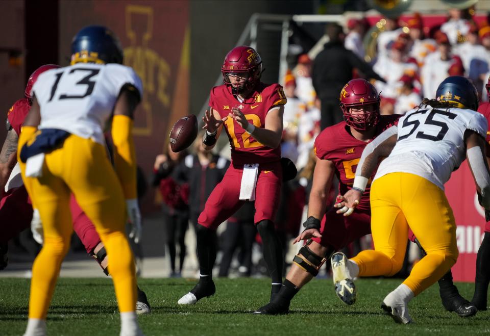 Iowa State quarterback Hunter Dekkers takes a snap in the first quarter against West Virginia on Nov. 5 at Jack Trice Stadium in Ames.