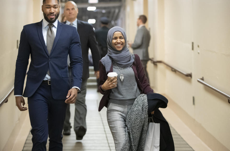 Rep.-elect Ilhan Omar, D-Minn., center, heads to a Democratic Caucus meeting in the basement of the Capitol as new members of the House and veteran representatives gathered behind closed doors to discuss their agenda when they become the majority in the 116th Congress, in Washington, on Nov. 15, 2018. (Photo: ASSOCIATED PRESS/J. Scott Applewhite)