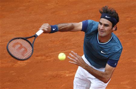 Roger Federer of Switzerland serves to Radek Stepanek of the Czech Republic during the Monte Carlo Masters in Monaco April 16, 2014. REUTERS/Eric Gaillard