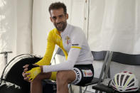 Vatican cyclist Rien Schuurhuis rests before the start of the men's elite road race at the world road cycling championships in Wollongong, Australia, Sunday, Sept. 25, 2022. (AP Photo/Rick Rycroft)