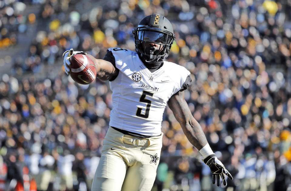 FILE - In this Nov. 10, 2018, file photo, Vanderbilt running back Ke'Shawn Vaughn celebrates as he runs into the end zone after catching a pass for a touchdown during the first half of an NCAA college football game against Missouri, in Columbia, Mo. Vaughn was named newcomer of the year on The Associated Press All-Southeastern Conference team, announced Monday, Dec. 3, 2018. (AP Photo/Jeff Roberson, File)