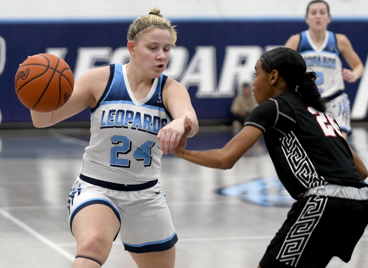 Louisville's Brooke Haren (24) finds a lane to drive against McKinley last month.