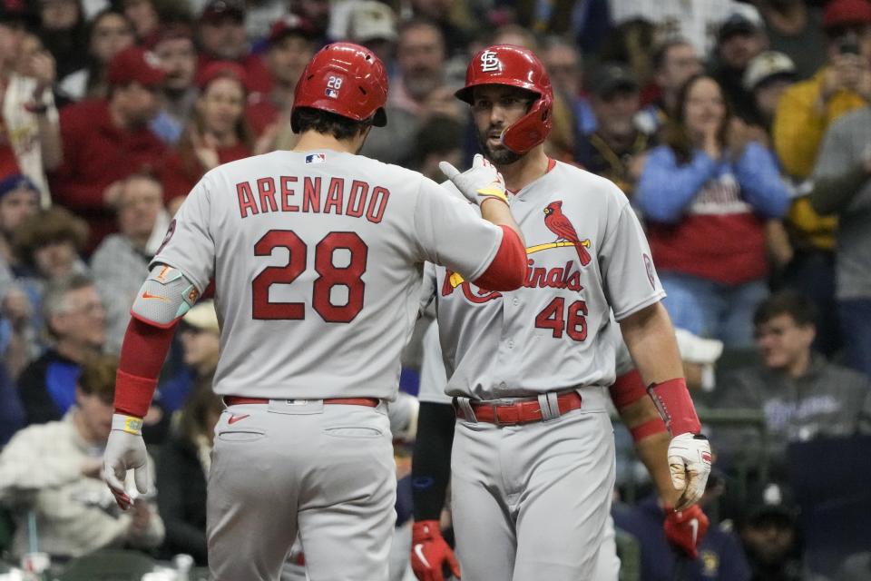 St. Louis Cardinals' Nolan Arenado is congratulated by Paul Goldschmidt (46) after hitting a two-run home run during the third inning of a baseball game against the Milwaukee Brewers Saturday, April 8, 2023, in Milwaukee. (AP Photo/Morry Gash)