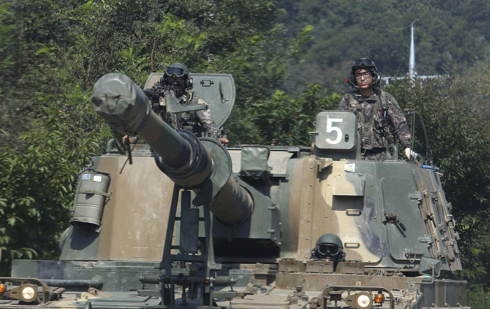 South Korean army soldiers drive a K-55 self-propelled howitzer during a military exercise in Paju, South Korea, near the border with North Korea. (AP Photo/Ahn Young-joon)