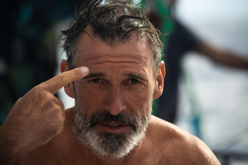 Lecomte emerges from the water with a piece of plastic stuck to his forehead.&nbsp; (Photo: @dwlangdon/The Vortex Swim)