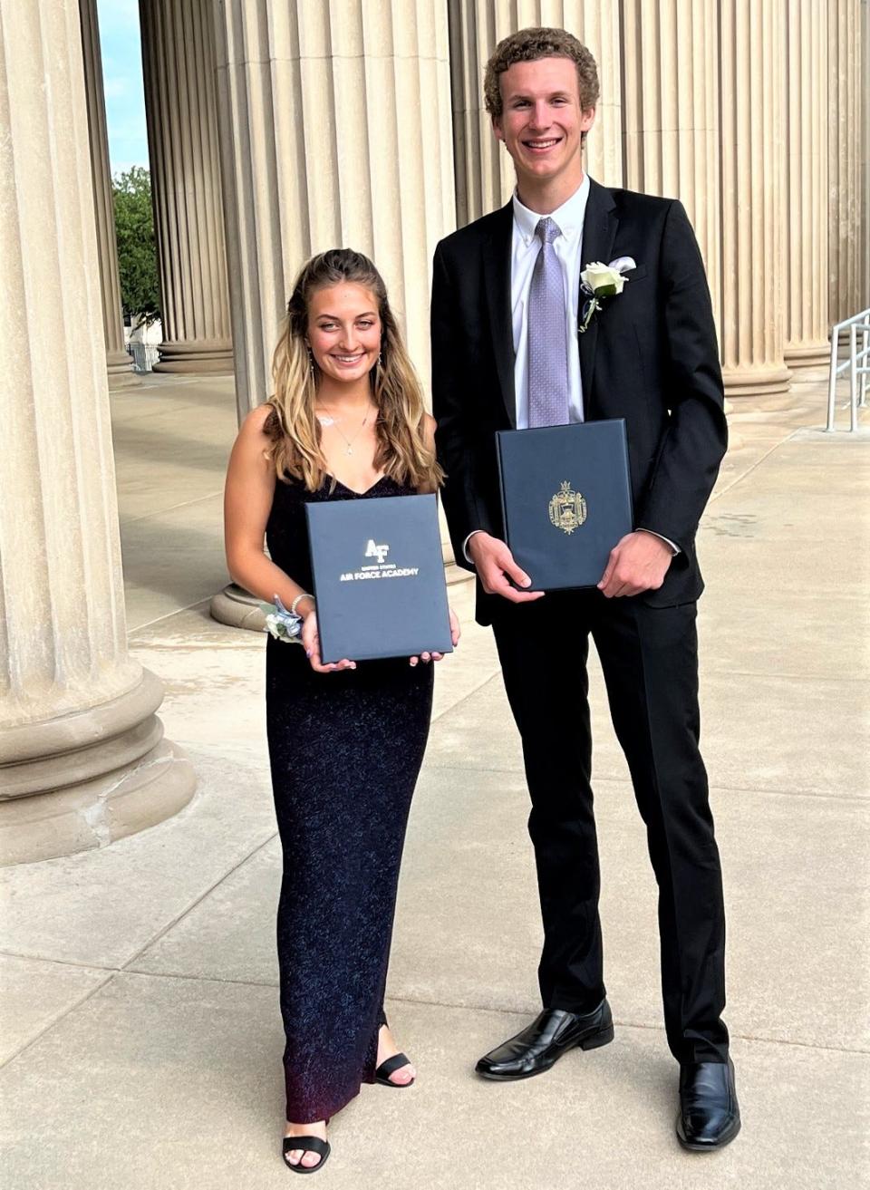 Lakeview High prom dates Nathan Pawlowicz and Ari Pontoni pose for photos outside the Federal Center in downtown Battle Creek. The two are also showing off their acceptance letters to attend the Naval Academy and Air Force Academy, respectively.