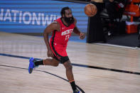 Houston Rockets' James Harden (13) brings the ball up the court against the Los Angeles Lakers during the second half of an NBA conference semifinal playoff basketball game Thursday, Sept. 10, 2020, in Lake Buena Vista, Fla. (AP Photo/Mark J. Terrill)