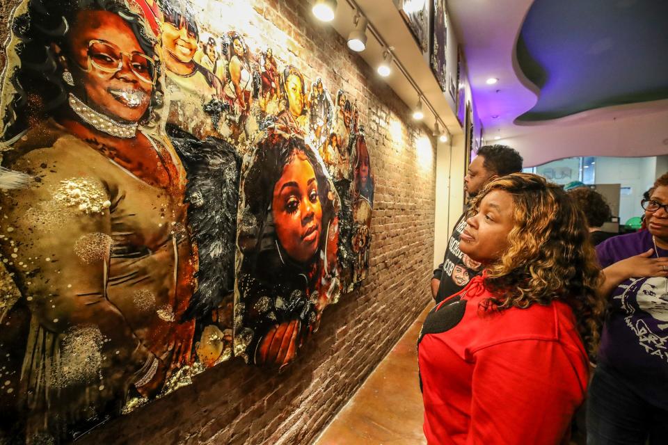 Tamika Palmer, Breonna Taylor's mother, takes in a work of art created by Charles Rice after it was unveiled at K.U.L.A. Gallery on the eve of the second anniversary of the killing of Taylor.  