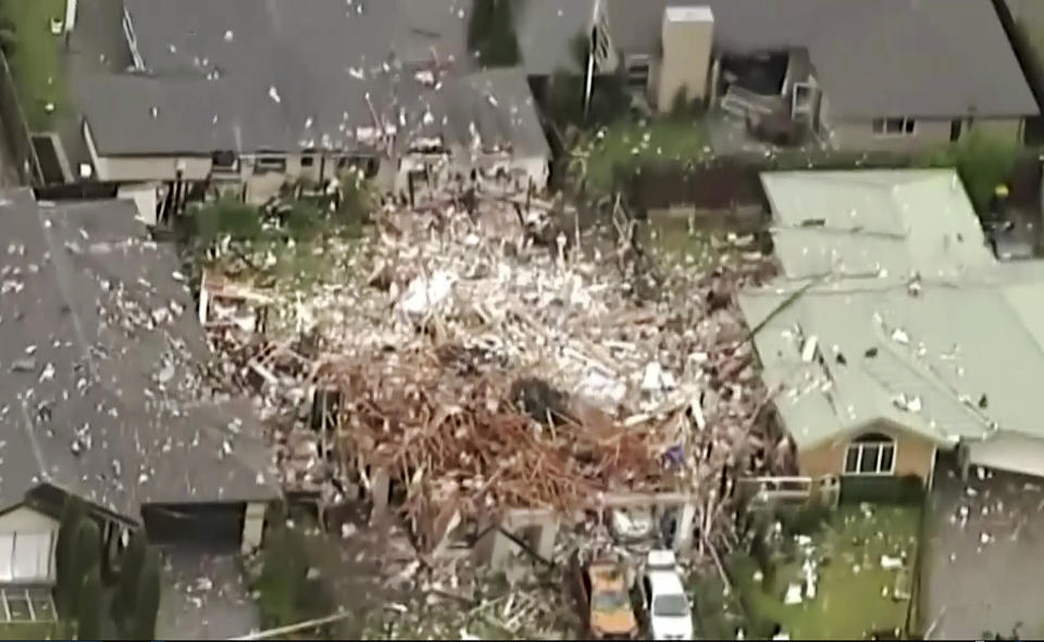This image taken from a video shows a damaged home following a gas explosion in Christchurch, New Zealand Friday, July 19, 2019. Several people were injured and dozens of homes evacuated in the New Zealand city of Christchurch on Friday after a huge gas explosion destroyed one home and damaged others. (NEWSHUB via AP)