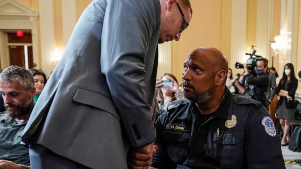 PHOTO: Stephen Ayres speaks to Harry Dunn, US Capitol Police officer, following testimony before the U.S. House Select Committee to investigate the January 6 Attack on the U.S. Capitol, in Washington, July 12, 2022. (Sarah Silbiger/Reuters)