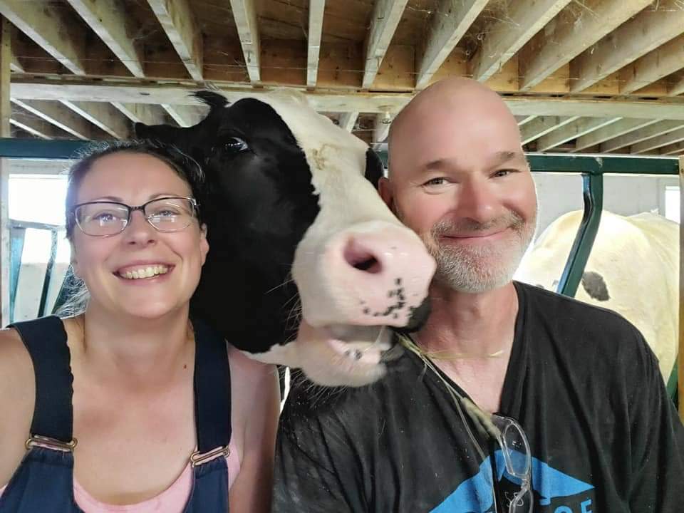 Zach Vanthournout, right, and his wife, Emily Evans, run a small dairy beef operation in Fredericton Junction, New Brunswick. Vanthournout said sales are down, but thinks consumers can save money by buying directly from farmers like him who have kept their prices low. 