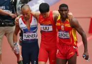 Xiang Liu of China gets assisted off the track by Andrew Turner of Great Britain and Jackson Quinonez of Spain after getting injured in the Men's 110m Hurdles Round 1 Heats on Day 11 of the London 2012 Olympic Games at Olympic Stadium on August 7, 2012 in London, England. (Photo by Cameron Spencer/Getty Images)