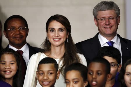 Canada's Prime Minister Stephen Harper (R), Jordan's Queen Rania Al Abdullah (C) and Tanzania's President Jakaya Kikwete (L) pose for photographs during a photo opportunity at the Saving Every Woman, Every Child: Within Arm's Reach in Toronto, Ontario, May 29, 2014. REUTERS/Aaron Harris