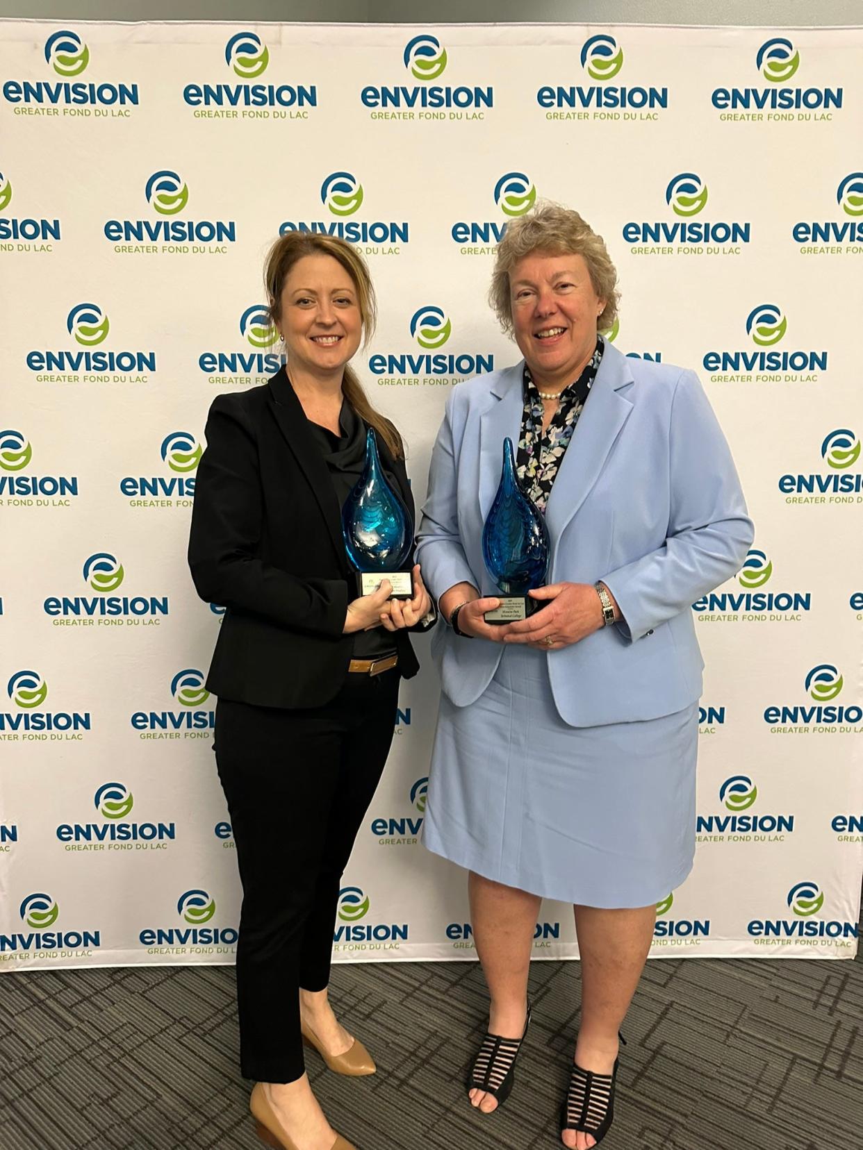 Katherine Vergos, SSM Health St. Agnes Hospital president, and Bonnie Baerwald, MPTC president, recently accepted the Eden-Schneider Award from Envision Greater Fond du Lac.
