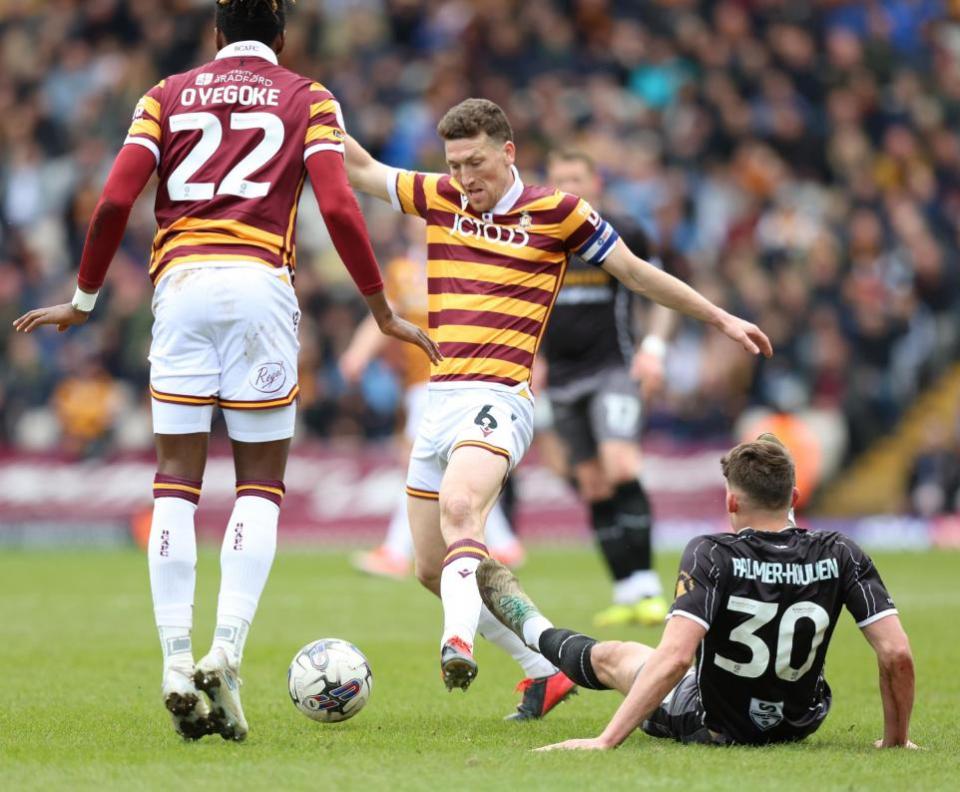 South Wales Argus: BUMP: County striker Seb Palmer-Houlden is knocked over at Bradford