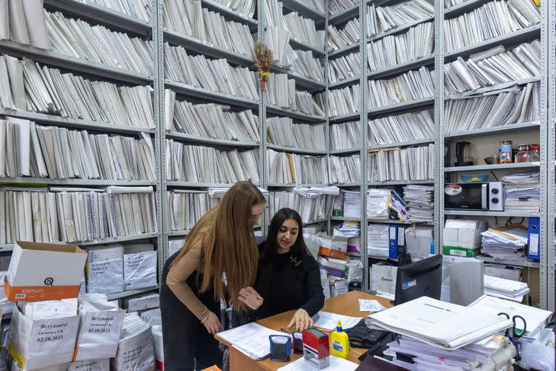 Legal clerks work in an office at the Pecherskyi District Court of Kyiv City in Kyiv