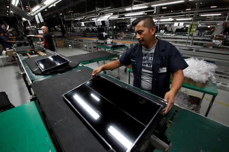 FILE PHOTO: An employee works at an LED TV assembly line at a factory that exports to the U.S. in Ciudad Juarez, Mexico, September 21, 2016. Picture taken September 21, 2016. REUTERS/Jose Luis Gonzalez/File photo