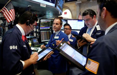 Traders work on the floor of the New York Stock Exchange (NYSE) in New York City, U.S., August 25, 2016. REUTERS/Brendan McDermid