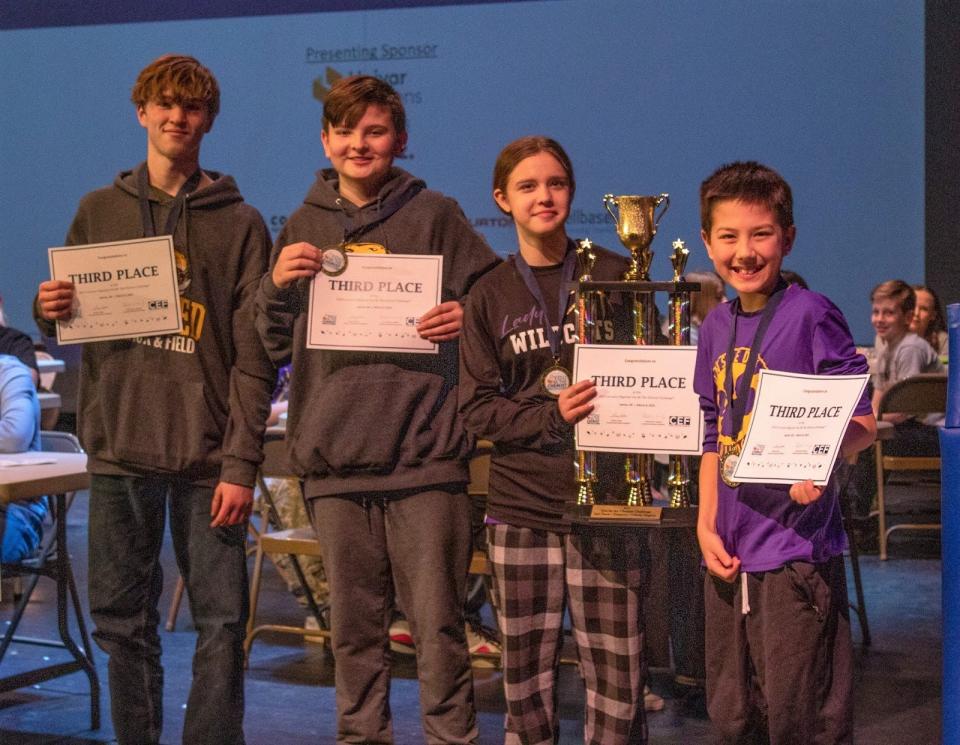 Onsted Middle School's team of, in no particular order, Taryn Cabla, Isabelle Annon, Adam Ellenwood and Corbin Weatherly, won third place in the "You Be the Chemist" student-science chemistry challenge and are pictured with their trophy.