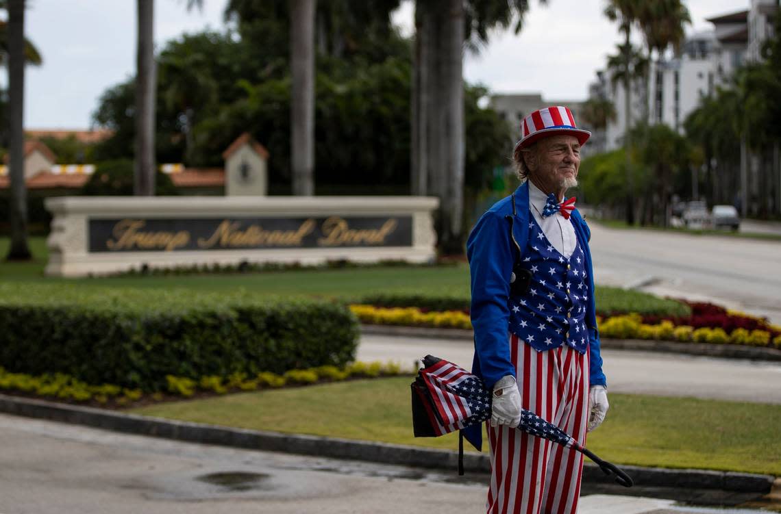 A Trump supporter dressed as Uncle Sam makes his way near the entrance of Trump National Doral on Monday, June 12, 2023, in Doral, Fla. Trump arrived at the hotel Monday afternoon, a day before his expected arraignment in federal court in Miami on Tuesday. MATIAS J. OCNER/mocner@miamiherald.com