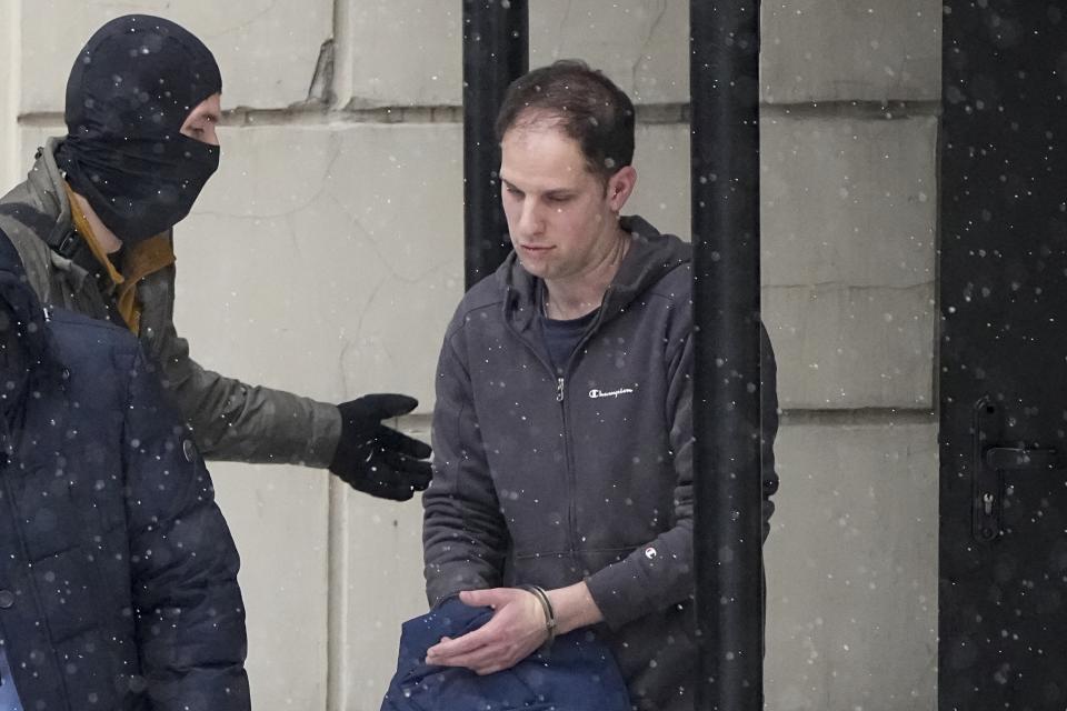 FILE - Wall Street Journal reporter Evan Gershkovich is escorted from a court hearing in Moscow, Russia, on Friday, Jan. 26, 2024. Gershkovich was detained on espionage charges in March 2023 – an accusation that he, his employer and the U.S. government denies. (AP Photo/Alexander Zemlianichenko, File)