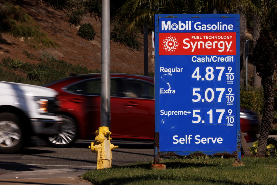 Gas prices grow along with inflation as this sign at a gas station shows in Solana Beach, California, U.S. November, 9, 2021.  REUTERS/Mike Blake