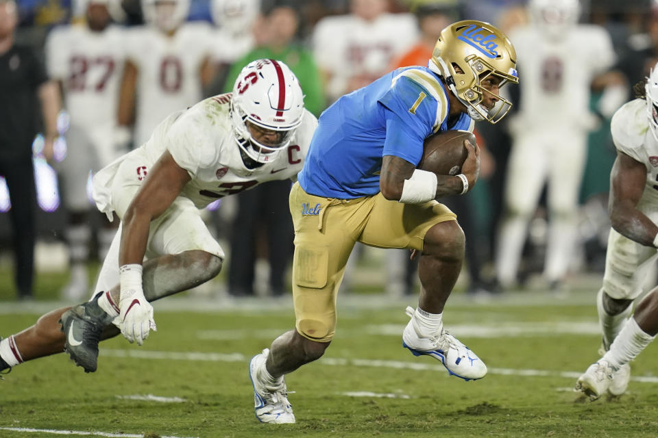 UCLA quarterback Dorian Thompson-Robinson (1) is tackled by Stanford linebacker Levani Damuni (3) during the second half of an NCAA college football game in Pasadena, Calif., Saturday, Oct. 29, 2022. (AP Photo/Ashley Landis)