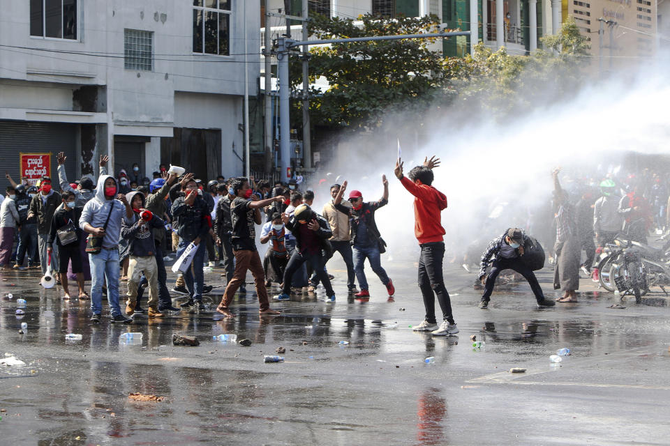 Police use water cannon to disperse demonstrators during a protest in Mandalay, Myanmar, Tuesday, Feb. 9, 2021. Police were cracking down on the demonstrators against Myanmar’s military takeover who took to the streets in defiance of new protest bans. (AP Photo)