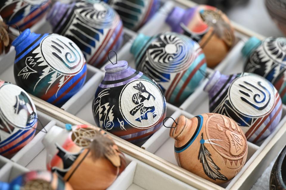 Carved items for sale at Utah Native Market Days at Thanksgiving Point in Lehi on Friday, Aug. 11, 2023. All proceeds are going to native student scholarships. There was hoop dancing, food and crafts. | Scott G Winterton, Deseret News