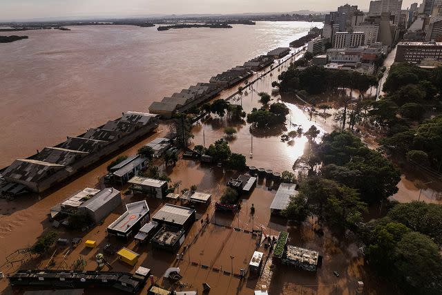 <p>NELSON ALMEIDA/AFP via Getty</p> Aerial view of the flooding in Brazil
