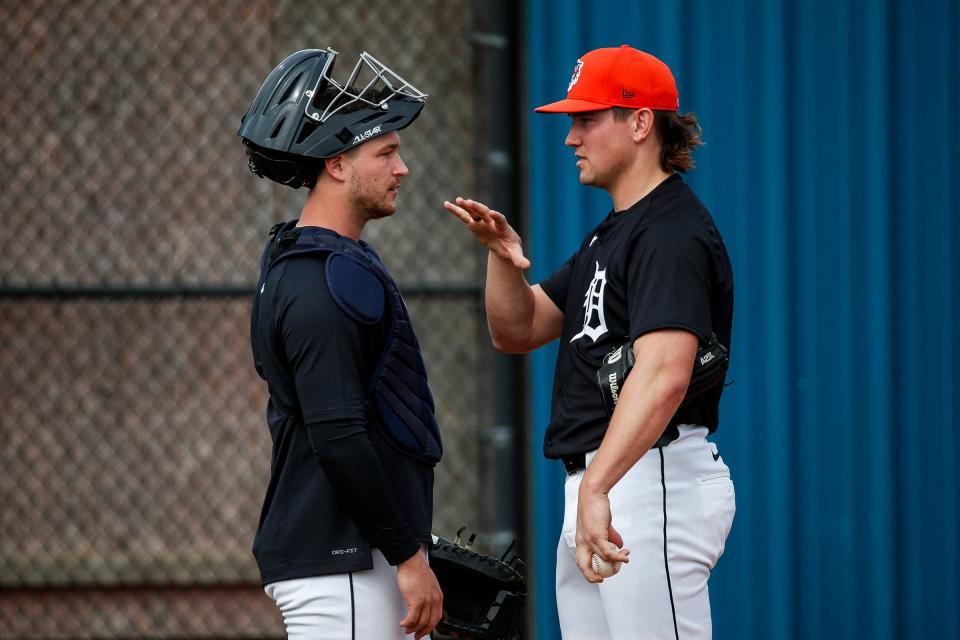 Detroit Tigers catcher Dillon Dingler talks to pitcher Tyler Holton during spring training at TigerTown in Lakeland, Fla. on Friday, Feb. 16, 2024.