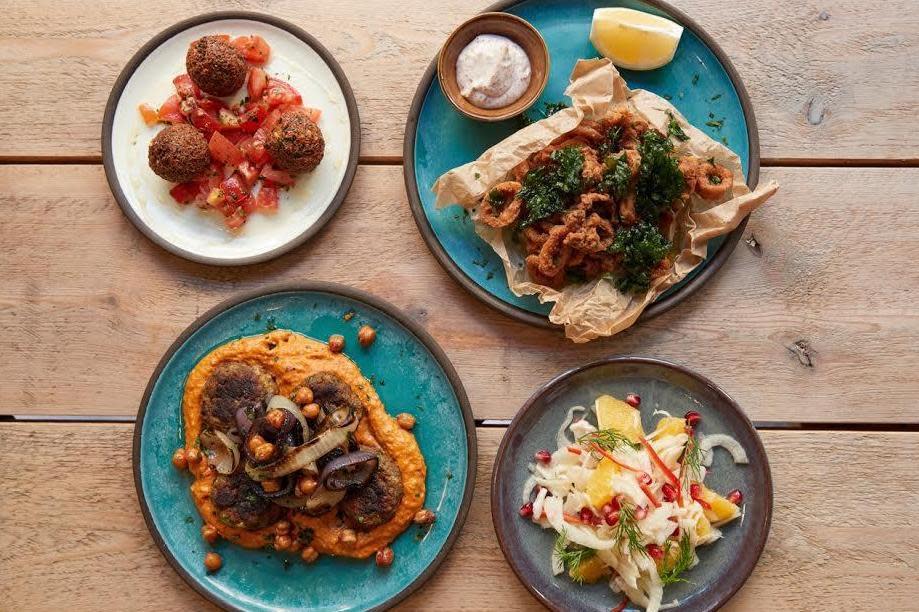 Shoreditch small plates: Dishes at Strut & Cluck, including calamari and feta fritters