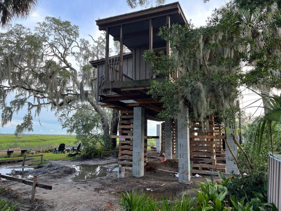 Betsy Cain's house on Wilmington Island is in the process of being raised over 10 feet in order to spare the house from flooding.