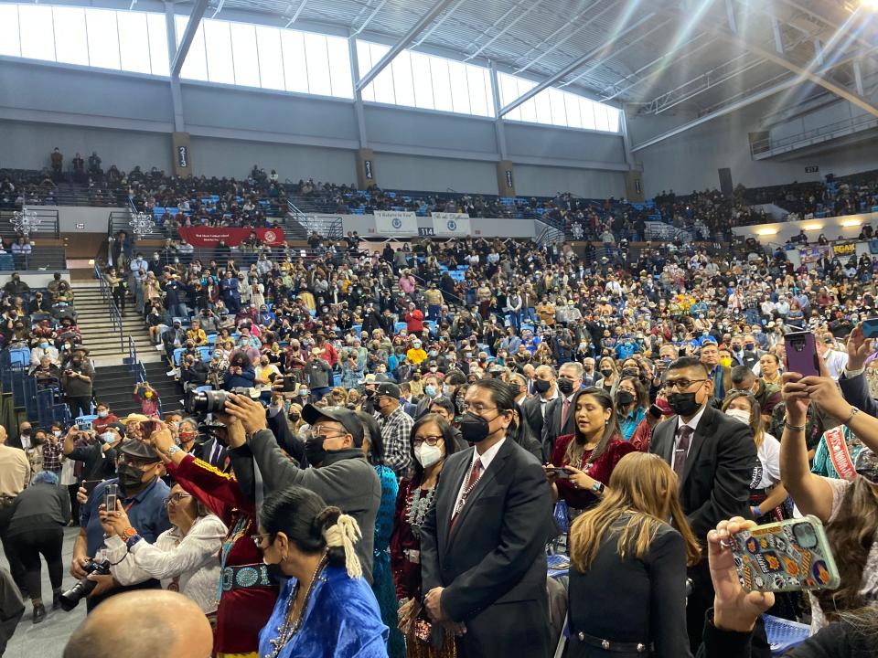 Outgoing Navajo Nation President Jonathan Nez (center) with his wife, outgoing First Lady Phefelia Nez, in the audience at Fort Defiance as the new president takes the oath of office.