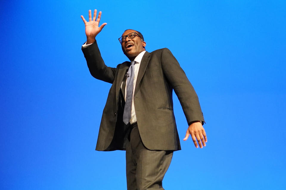 British Chancellor of the Exchequer Kwasi Kwarteng waves prior to his speech at the Conservative Party annual conference at the International Convention Centre in Birmingham, Monday Oct. 3, 2022. (Stefan Rousseau/PA via AP)