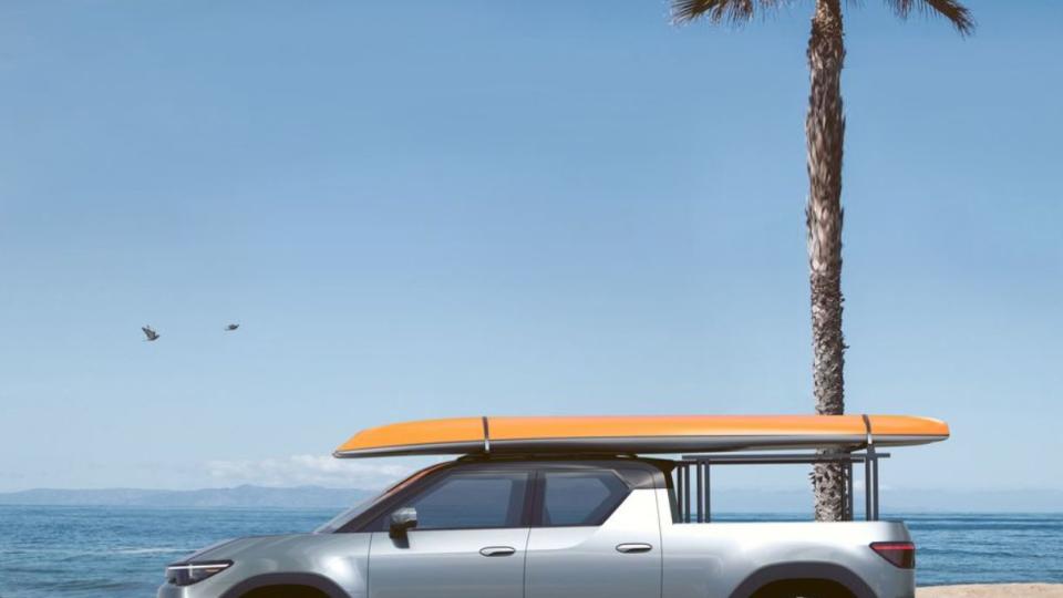 a car with a surfboard on top of it