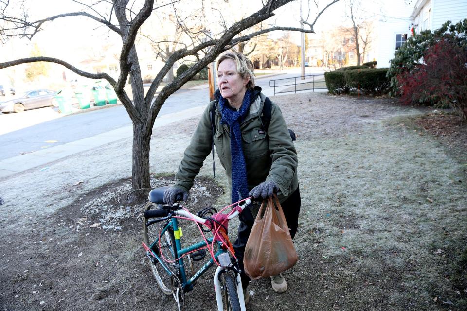 Susan Breda of Rochester stops at the food pantry at the First Church Congregational in Rochester Wednesday, Jan. 3, 2023, and talks about the struggles facing homeless people living in an encampment outside the church, and across the nation.