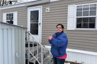 Amy Case stand in her mobile home park, Tuesday, Jan . 23, 204, in Auburn Mass. where residents complain they are facing double-digit rent increases that they cannot afford. Their concerns are echoed nationally where a report from Harvard University found 22.4 million rent household are rent burdened. Monthly rent has outpaced income across the U.S., and forced many to make tough decisions between everyday necessities and a home. In turn, a record number of people are becoming homeless and evictions filings have ratcheted up as pandemic-era eviction moratoriums and federal assistance ends. (AP Photo/Michael Casey)