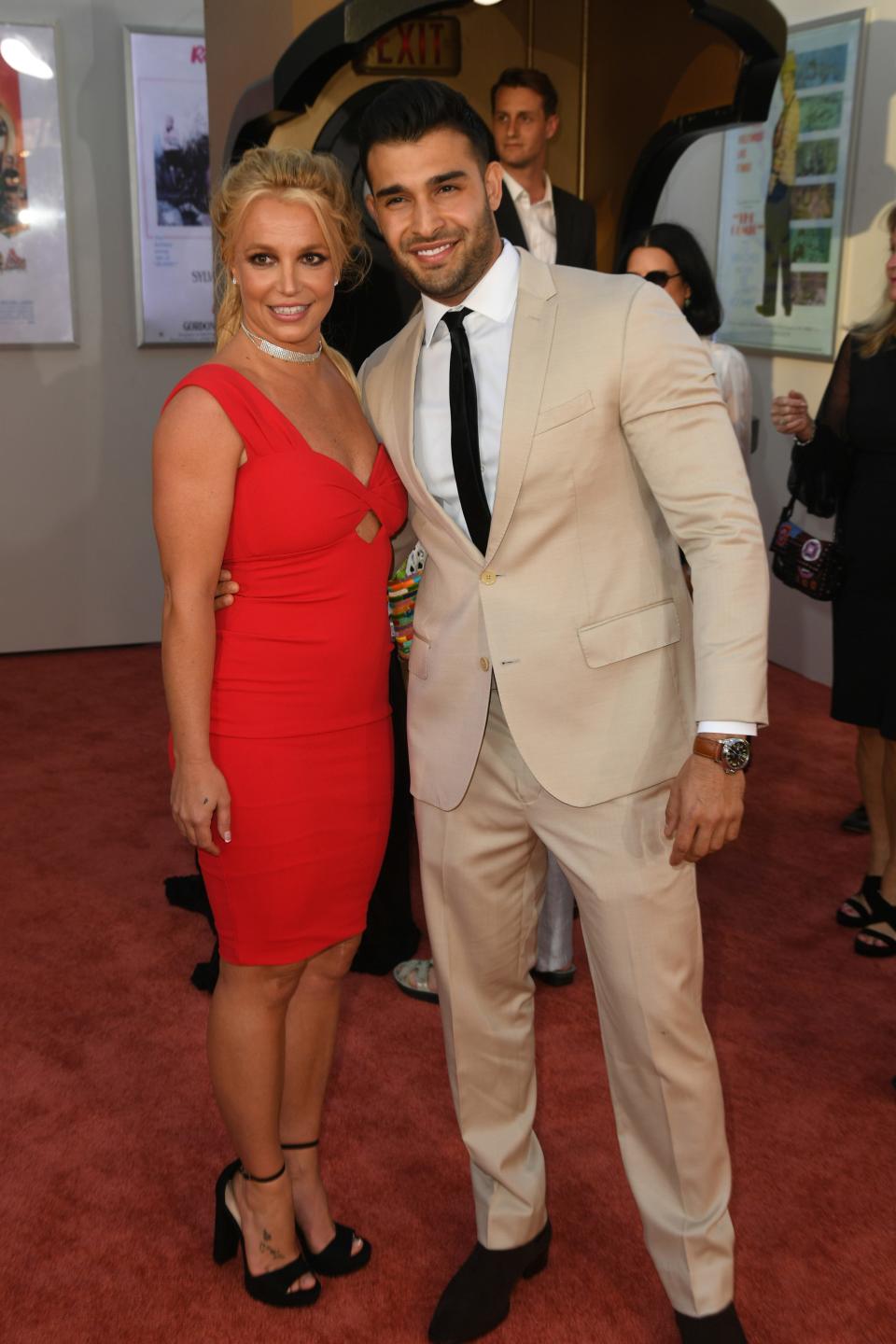 Britney Spears and Sam Asghari attend the Sony Pictures' "Once Upon A Time...In Hollywood" Los Angeles Premiere on July 22, 2019 in Hollywood, California.