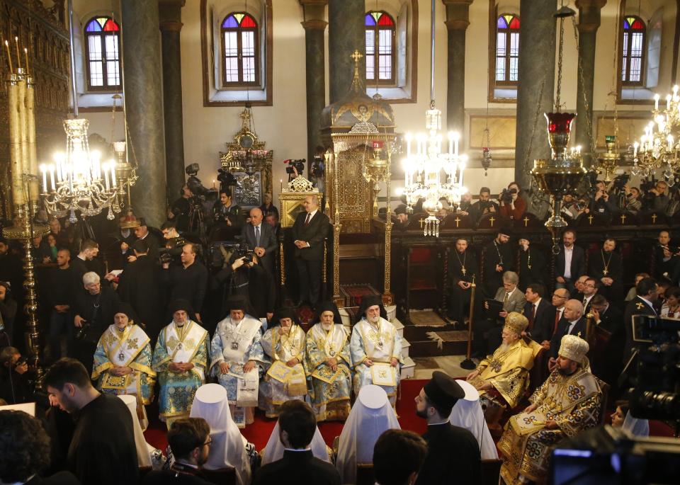 Ecumenical Patriarch Bartholomew I, second right, and Metropolitan Epiphanius, the head of the independent Ukrainian Orthodox Church, right, attend a religion service at the Patriarchal Church of St. George in Istanbul, Sunday, Jan. 6, 2019. An independent Ukrainian Orthodox church has been created at a signing ceremony in Turkey, formalizing a split with the Russian church it had been tied to since 1686. (AP Photo/Lefteris Pitarakis)